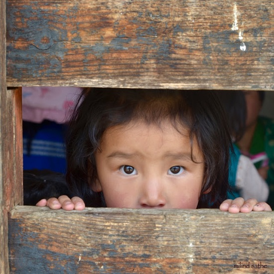 Little girl at Ura village festival near Bumthang, Bhutan