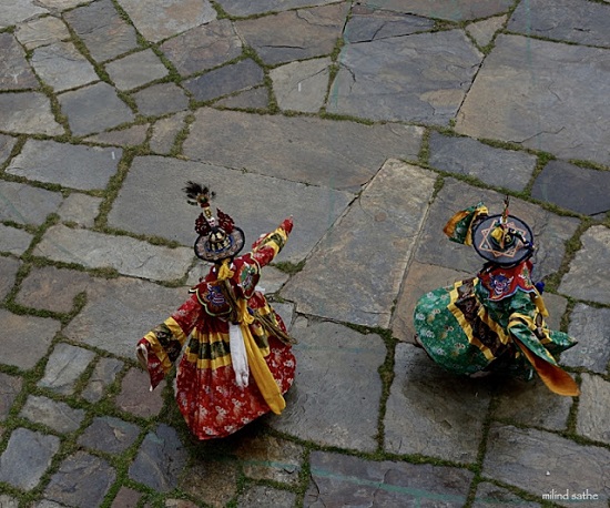 View from above - Dancers at the monastery festival in Bhutan
