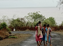 Women on a coastal road in Kokan